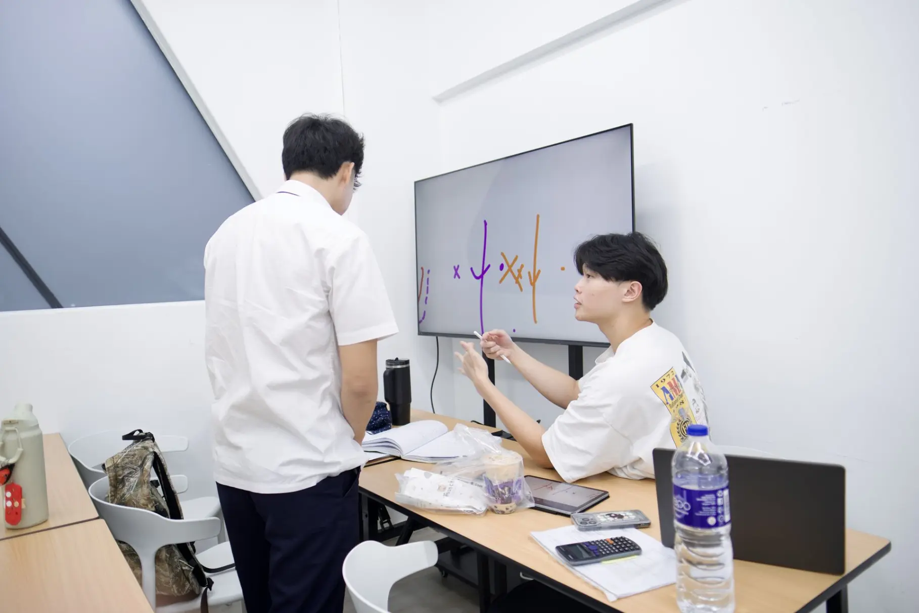 Tutor helping student